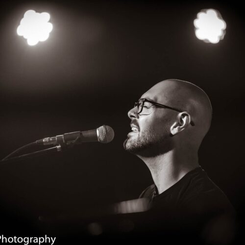 Dan Burnett singing black and white