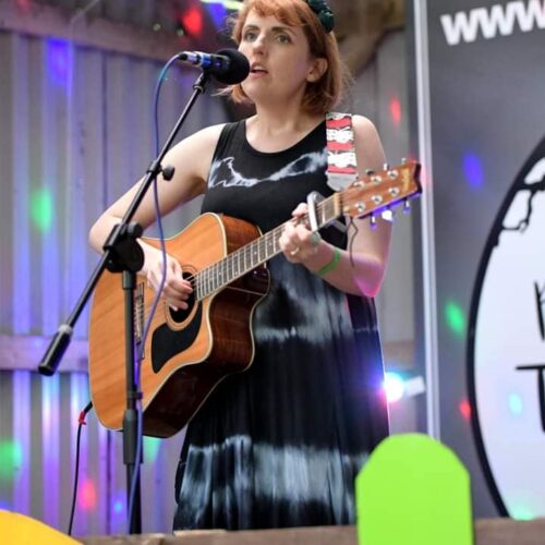 Lu Brown playing guitar